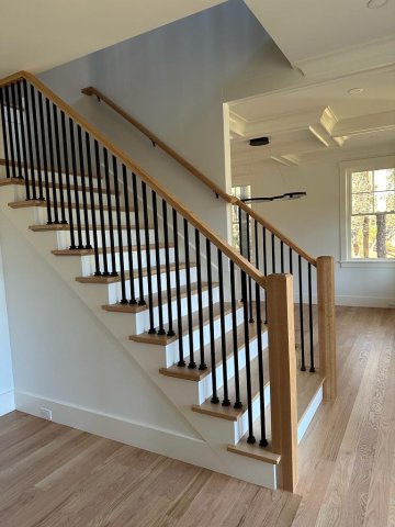A picture of simple stair with iron balusters