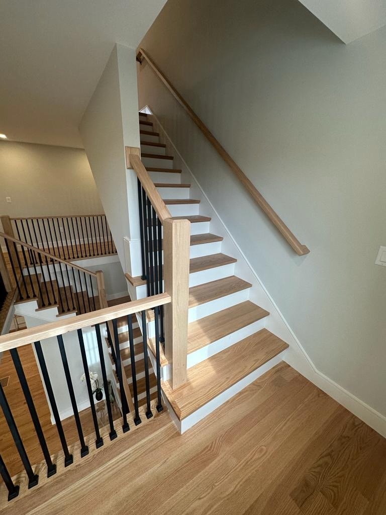 A picture of simple stair with iron balusters
